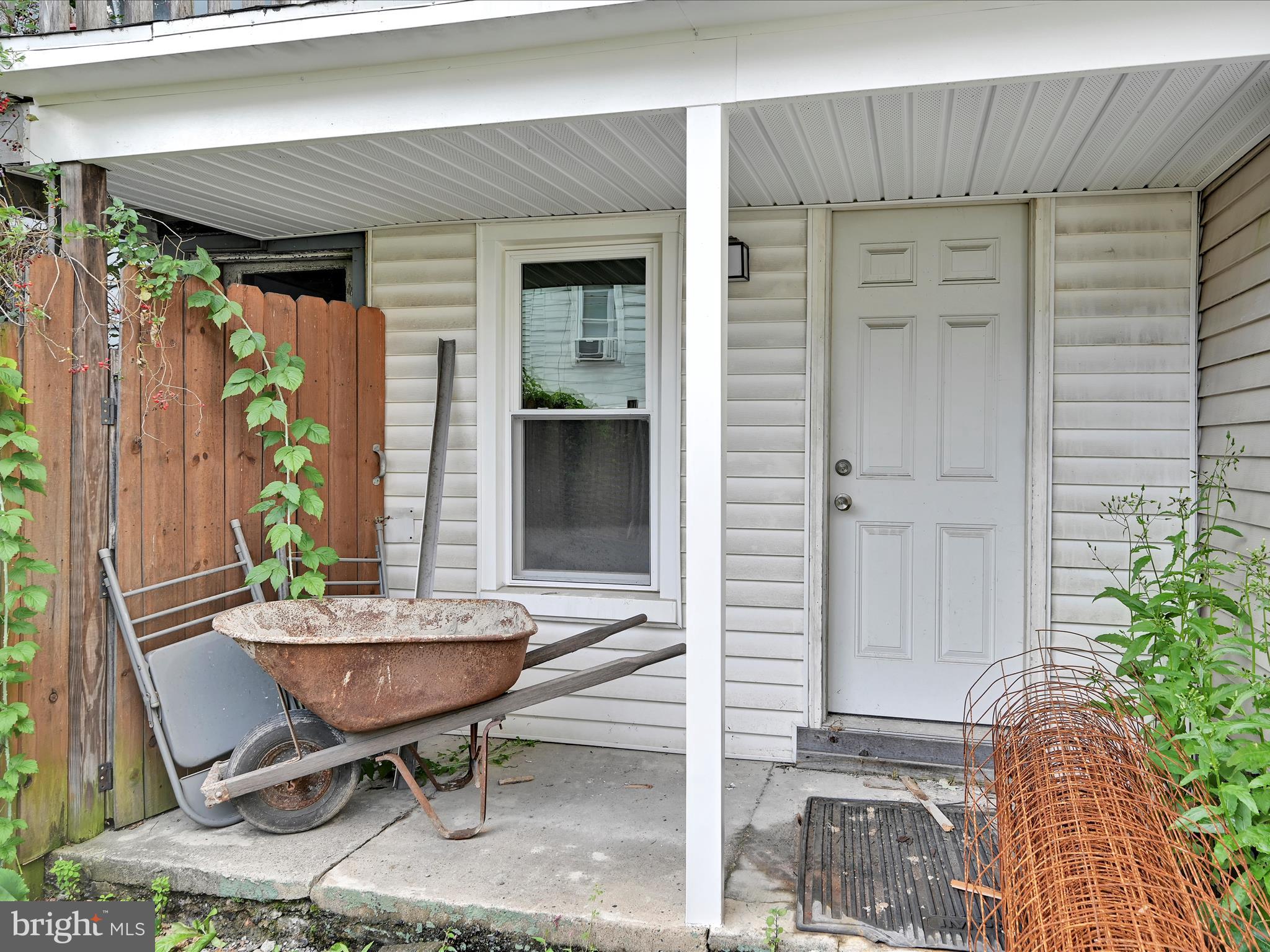 427 East Centre Street Mahanoy City, PA 17948 - Photo 8 of 29 a view of a house with a chairs in patio