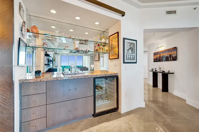 a dining room with furniture and chandelier