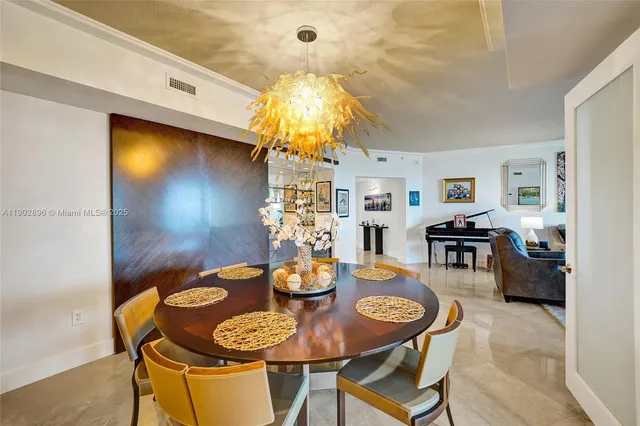 a view of living room kitchen and entryway