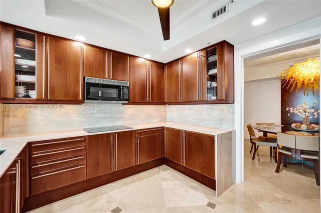 a view of a livingroom with furniture and a potted plant