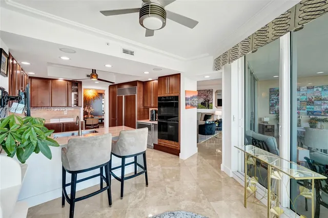 a bedroom with a large bed and a large window