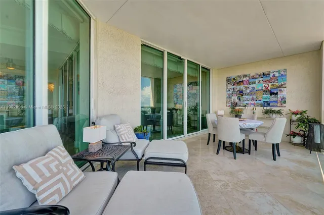 a bathroom with a tub a sink and a large mirror