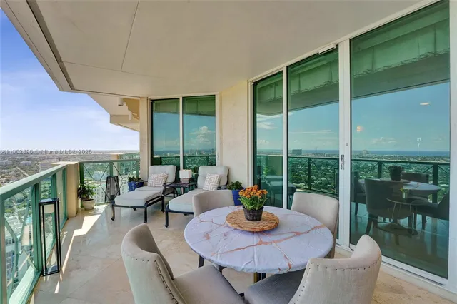 a bathroom with a granite countertop sink mirror and double