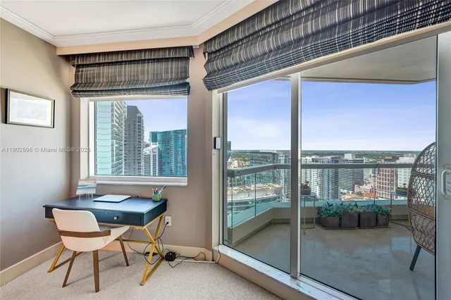 a spacious bedroom with two beds and a large window