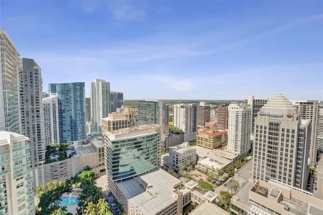 a living room with furniture a rug and a large window