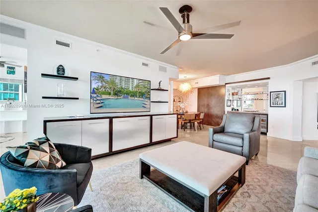 a living room with furniture and a potted plant