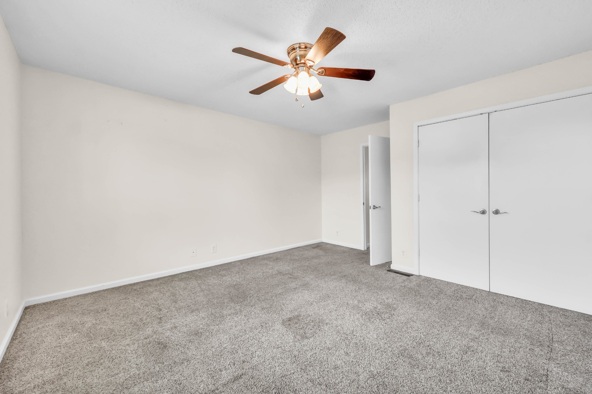 2451 Wilson Road, Unit 6 Clarksville, TN 37043 - Photo 12 of 21 an empty room with closet and ceiling fan