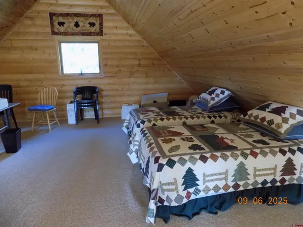 a view of a livingroom with furniture