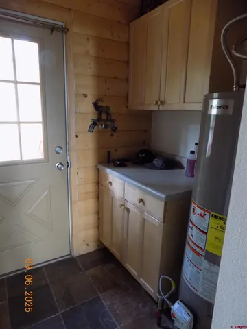 a kitchen with a sink and cabinets
