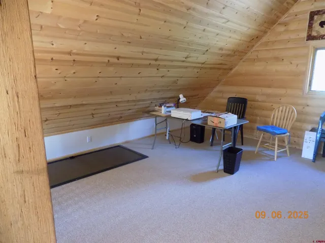 a view of a patio with table and chairs