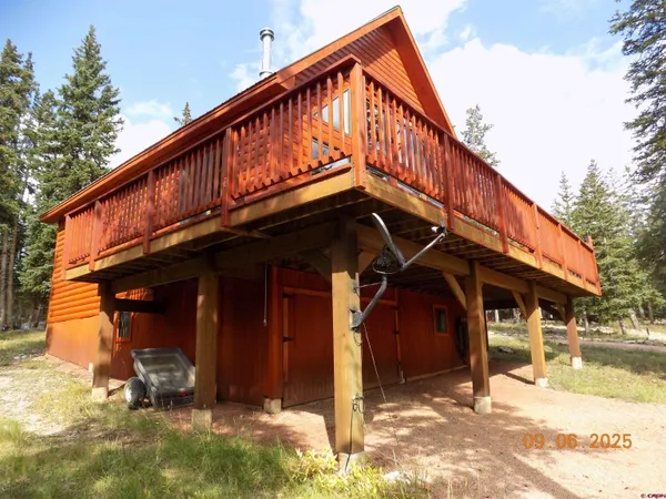 a view of a house with wooden deck