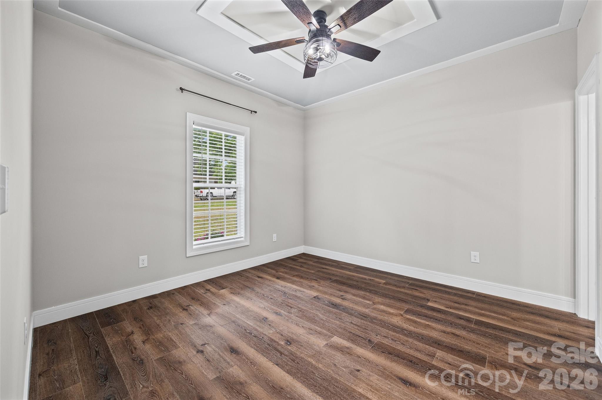103.5 Foote Street Chester, SC 29706 - Photo 12 of 22 a view of an empty room with wooden floor and a window