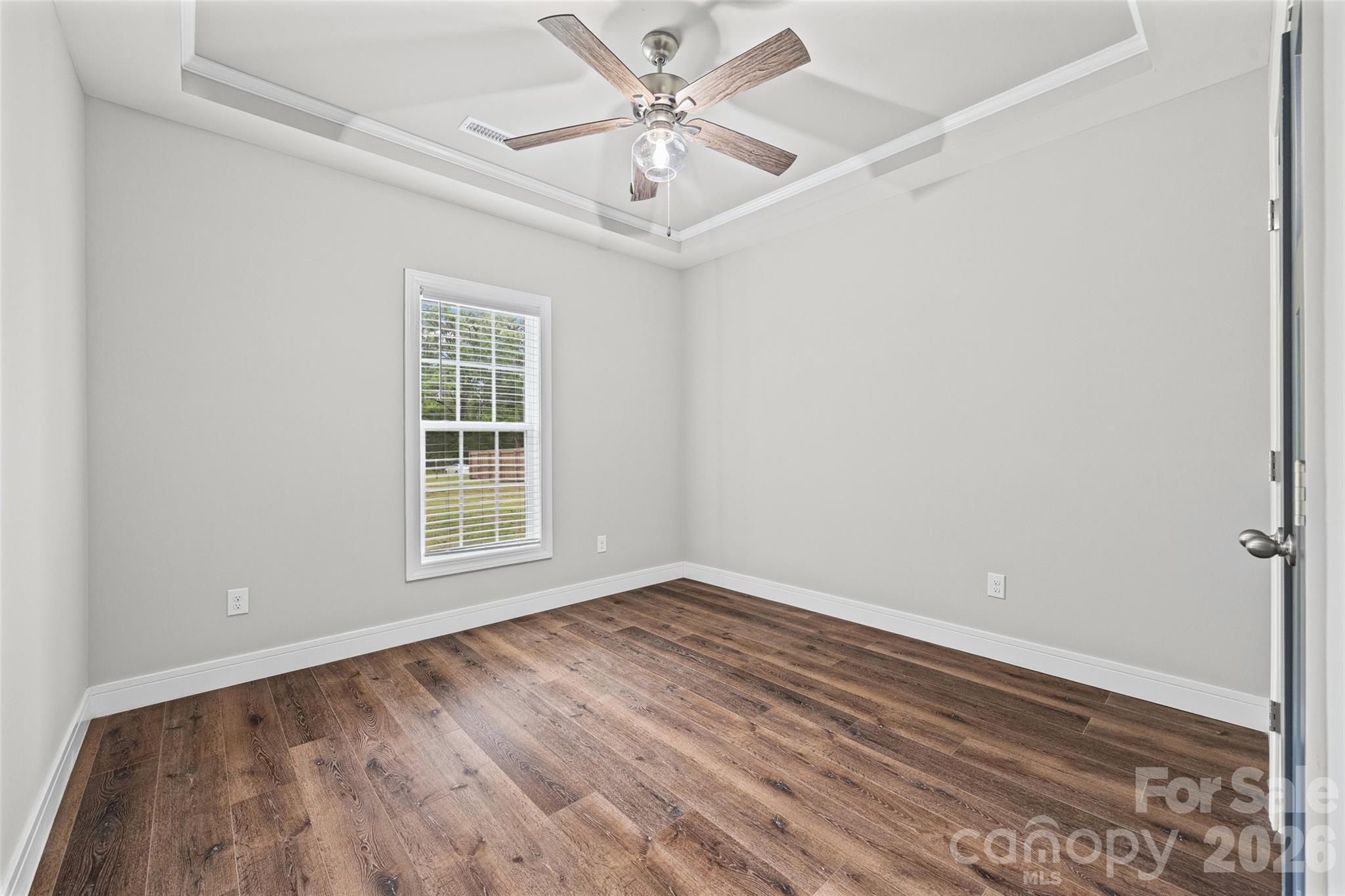 103.5 Foote Street Chester, SC 29706 - Photo 16 of 22 an empty room with a window and a ceiling fan