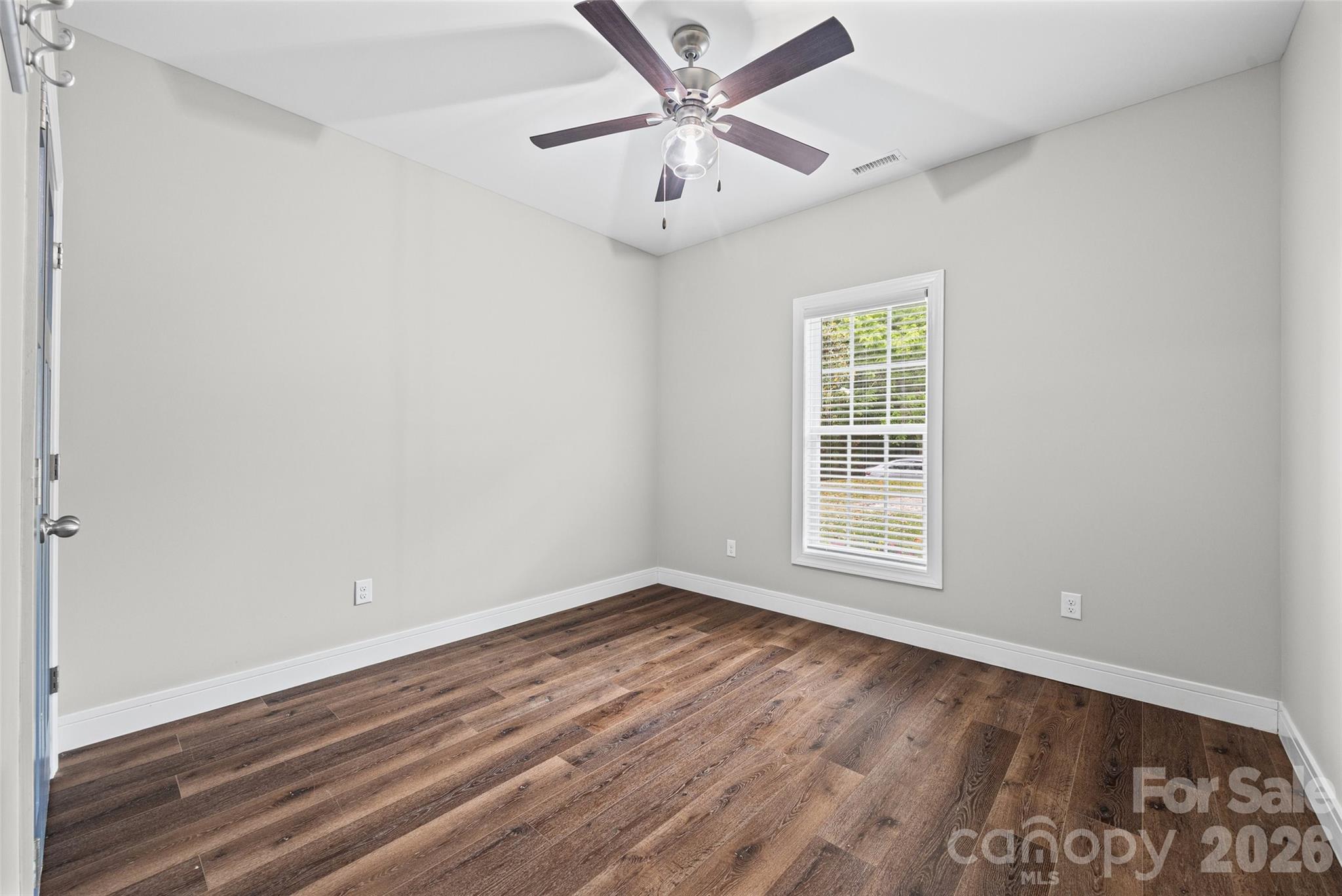 103.5 Foote Street Chester, SC 29706 - Photo 18 of 22 wooden floor in an empty room with a window