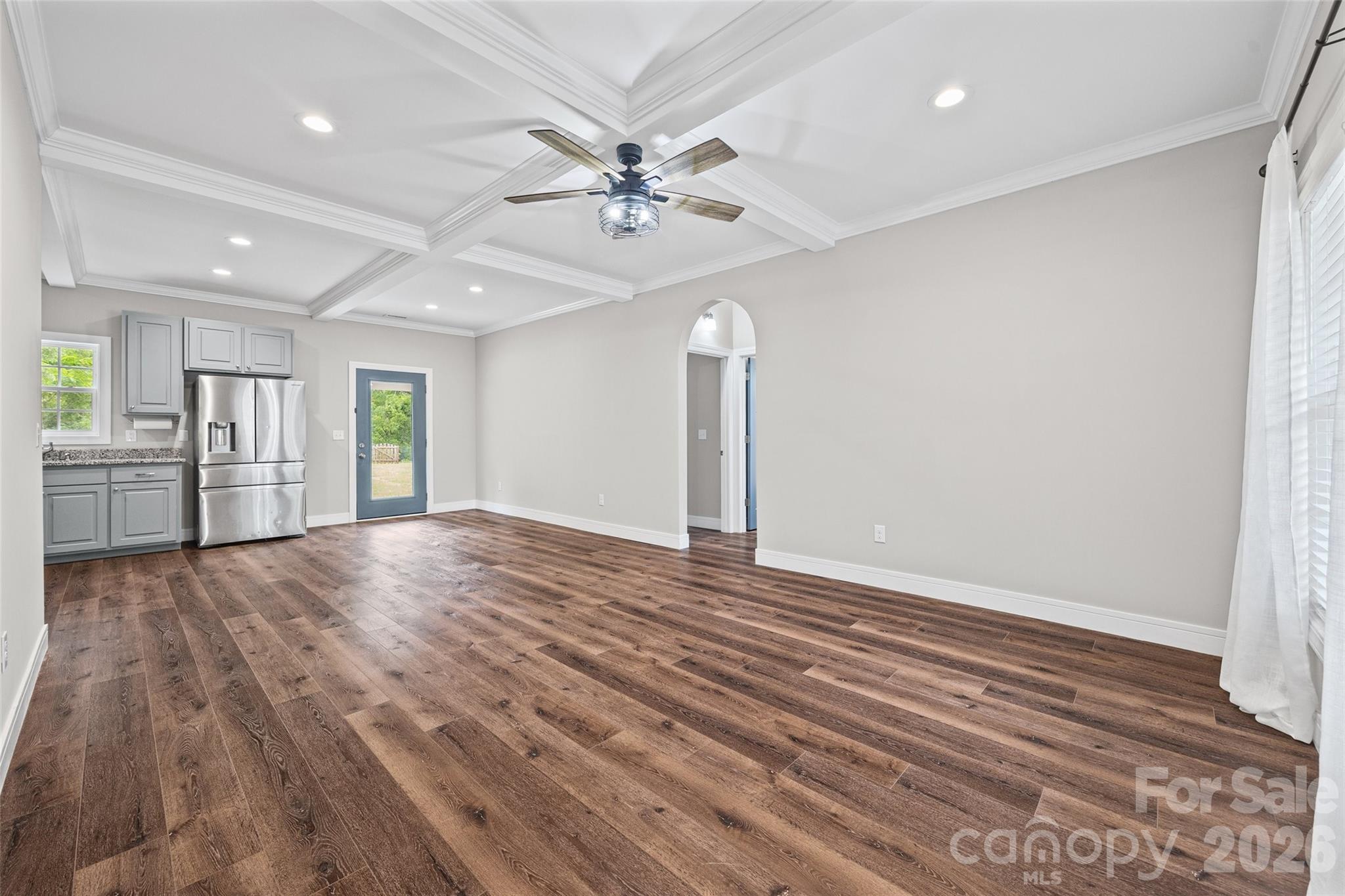 103.5 Foote Street Chester, SC 29706 - Photo 4 of 22 wooden floor in an empty room with a window