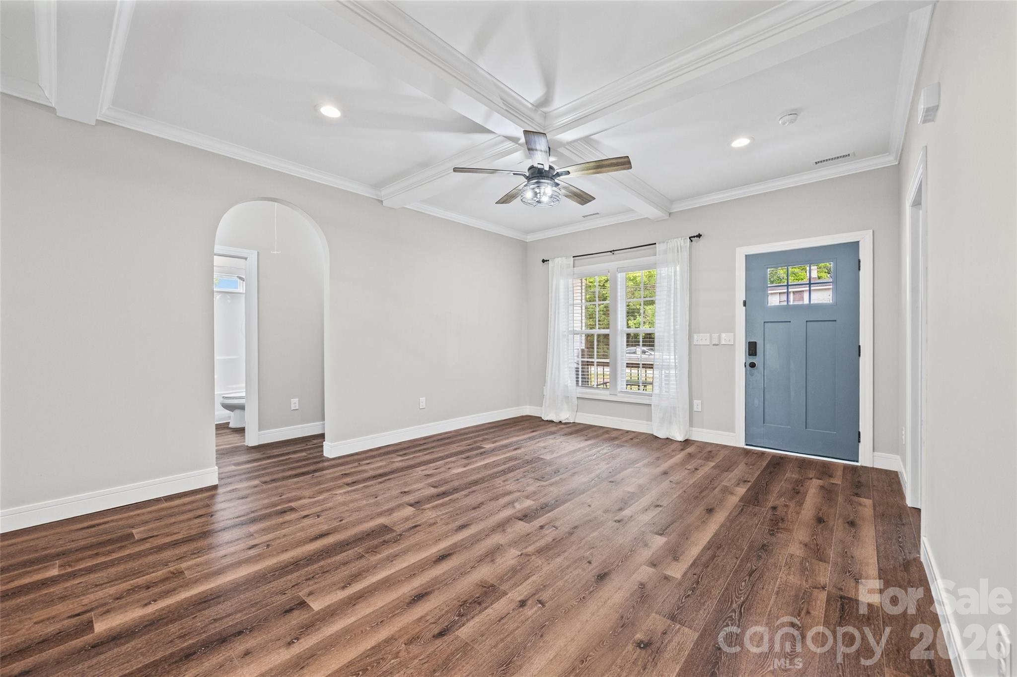 103.5 Foote Street Chester, SC 29706 - Photo 5 of 22 a view of an empty room with window and wooden floor