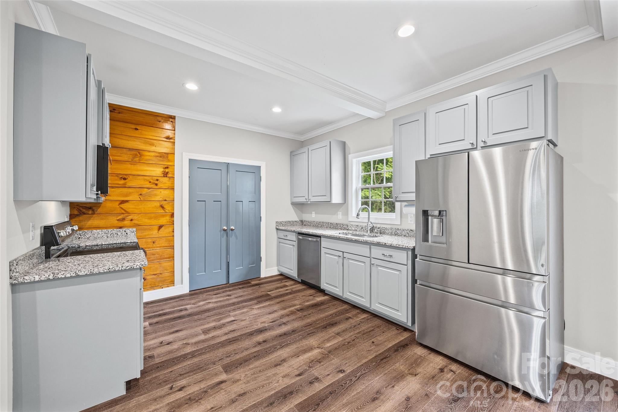 103.5 Foote Street Chester, SC 29706 - Photo 7 of 22 a kitchen with a refrigerator cabinets and wooden floor