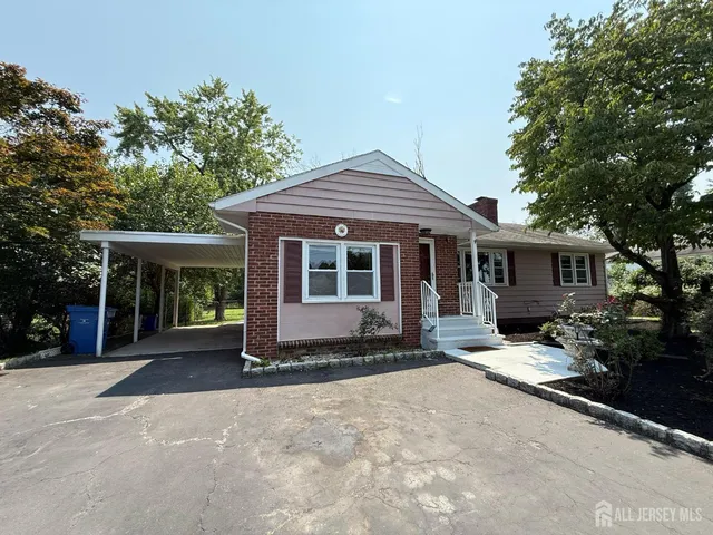 a front view of a house with a garden and porch