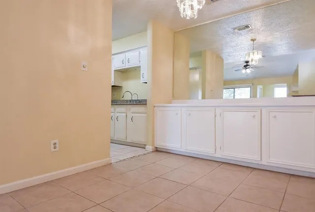 a view of a bathroom with a sink and a mirror
