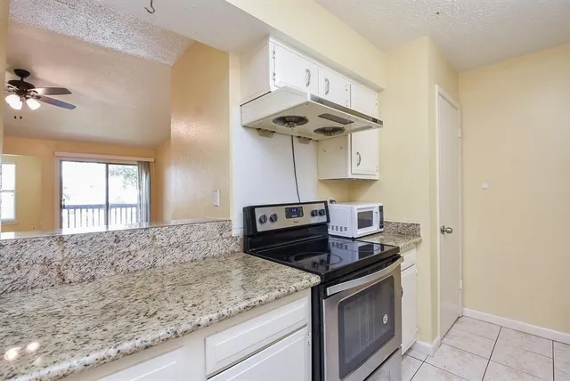 a kitchen with a stove and a sink
