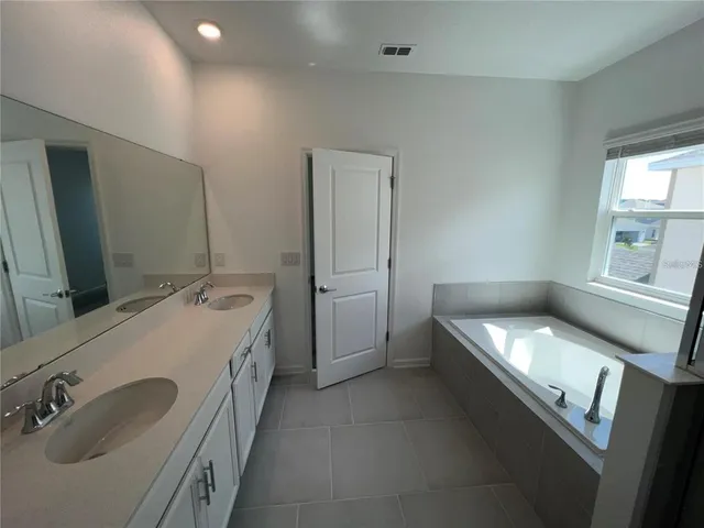 a bathroom with a glass door shower and toilet