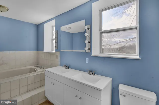 a bathroom with a sink and a bathtub