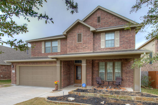 1905 Nelson Ranch Loop Cedar Park, TX 78613 - Photo 1 of 1 a front view of a house with garden