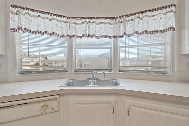 a bathroom with a sink and a large mirror