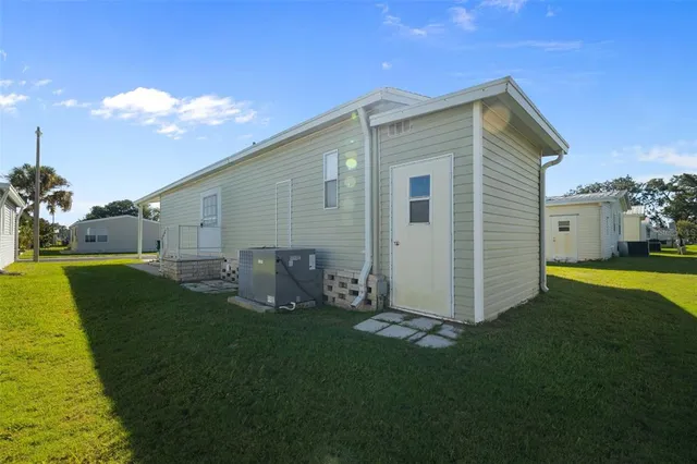 a front view of house with yard and seating area