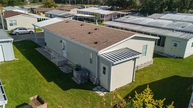 a view of a house with backyard