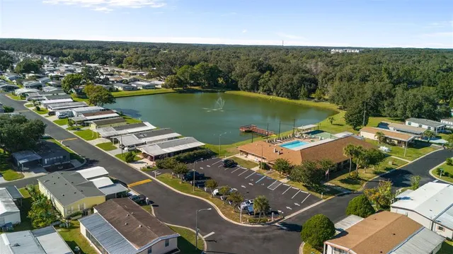 an aerial view of a house with a lake view