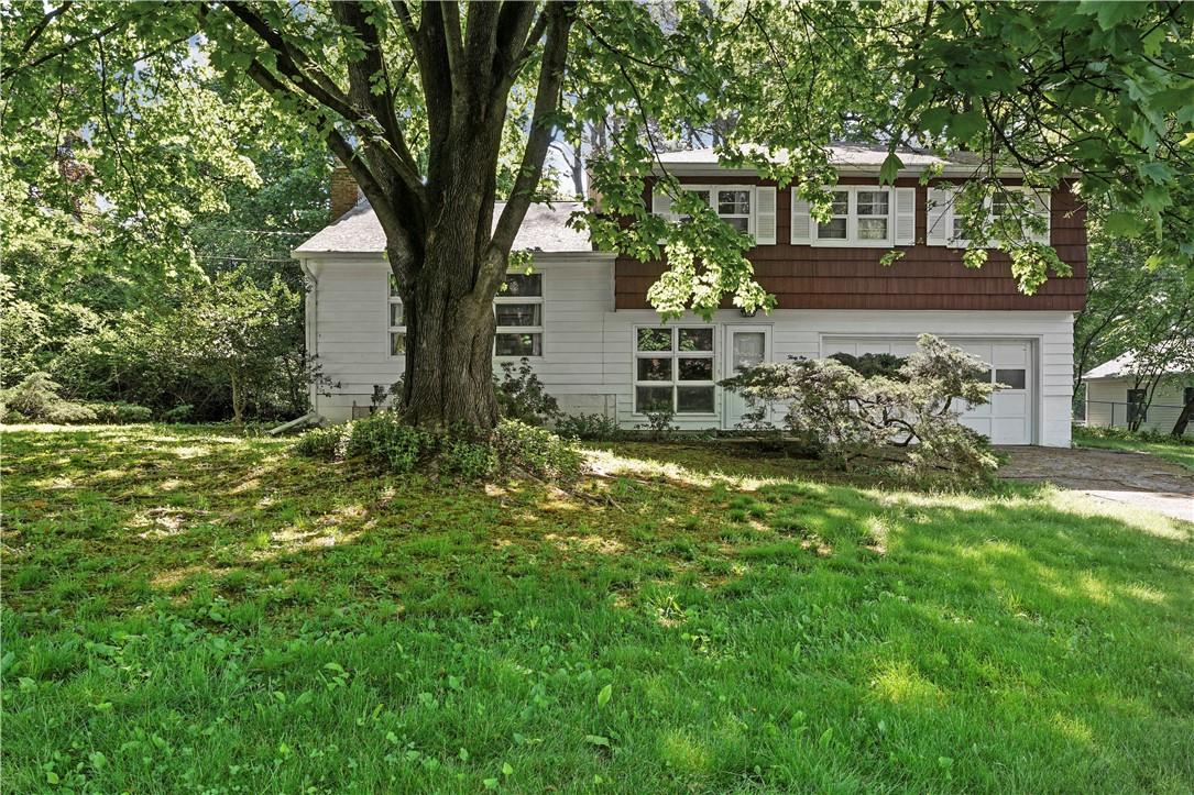 a view of house with yard