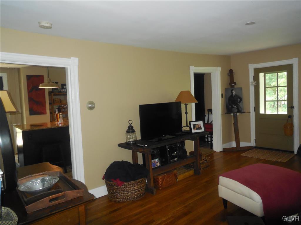 1425 North Brookside Road Lower Macungie Township, PA 18106 - Photo 12 of 31 a living room with furniture and a flat screen tv