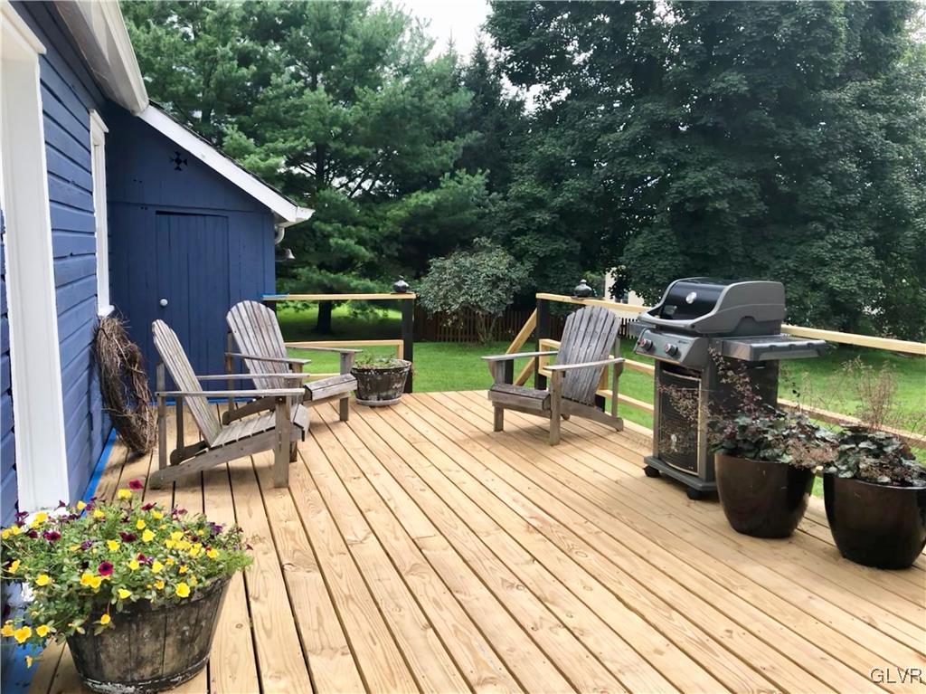 1425 North Brookside Road Lower Macungie Township, PA 18106 - Photo 27 of 31 a view of a chairs and table on the deck with wooden floor