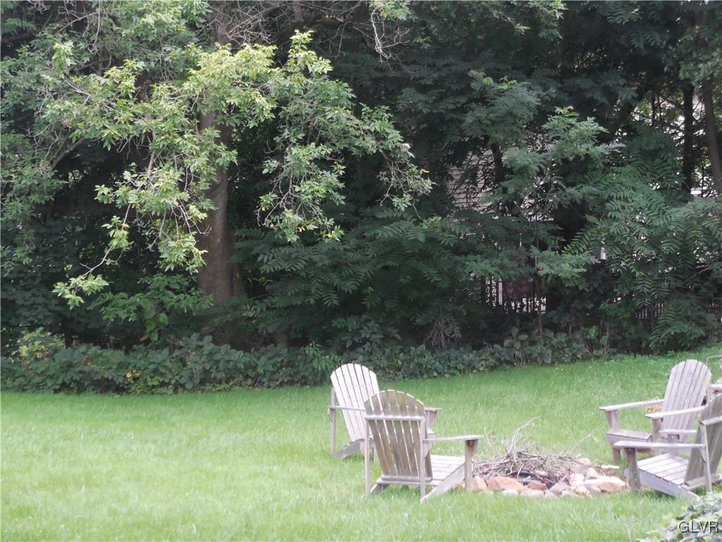 1425 North Brookside Road Lower Macungie Township, PA 18106 - Photo 30 of 31 a backyard of a house with table and chairs