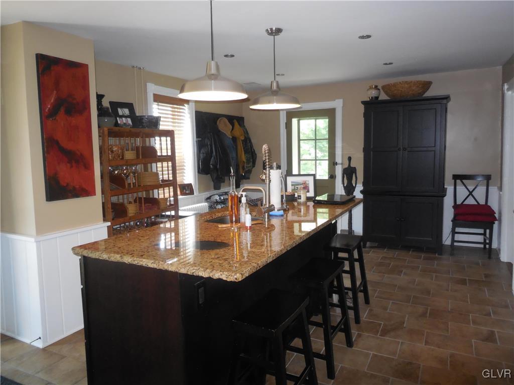 1425 North Brookside Road Lower Macungie Township, PA 18106 - Photo 6 of 31 a dining table with chairs and window