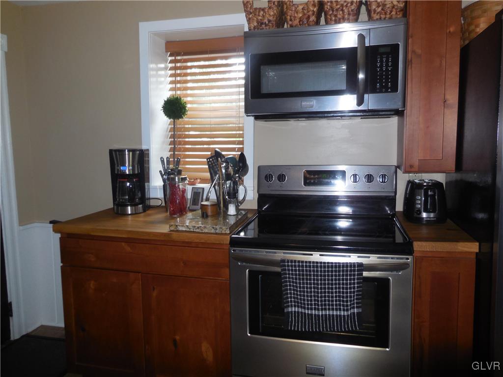 1425 North Brookside Road Lower Macungie Township, PA 18106 - Photo 8 of 31 a stove top oven sitting inside of a kitchen