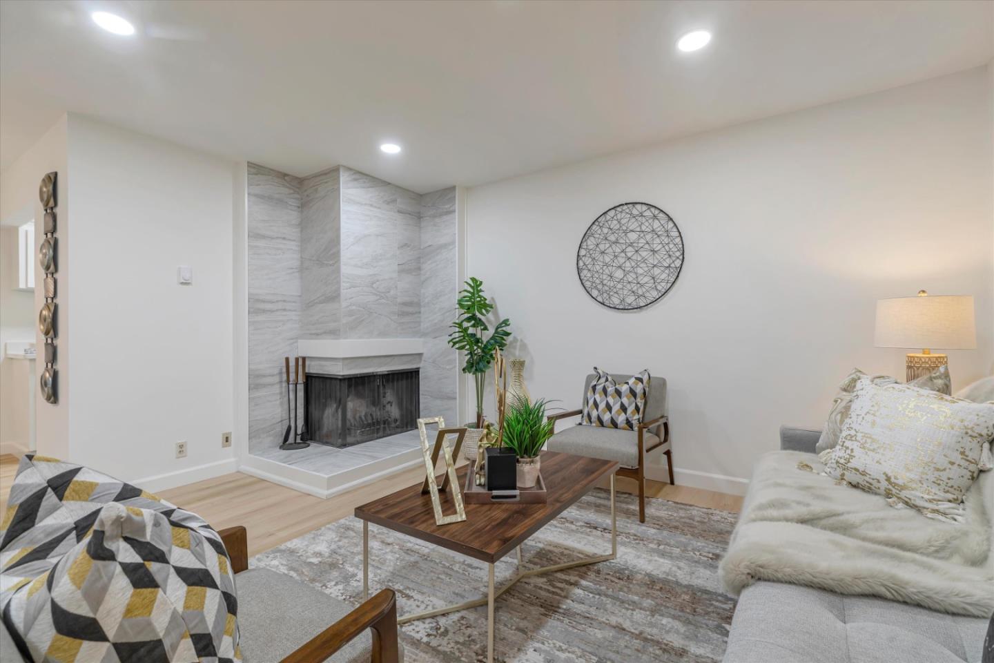 500 West Middlefield Road, Unit 142 Mountain View, CA 94043 - Photo 15 of 59 a living room with furniture and a fireplace