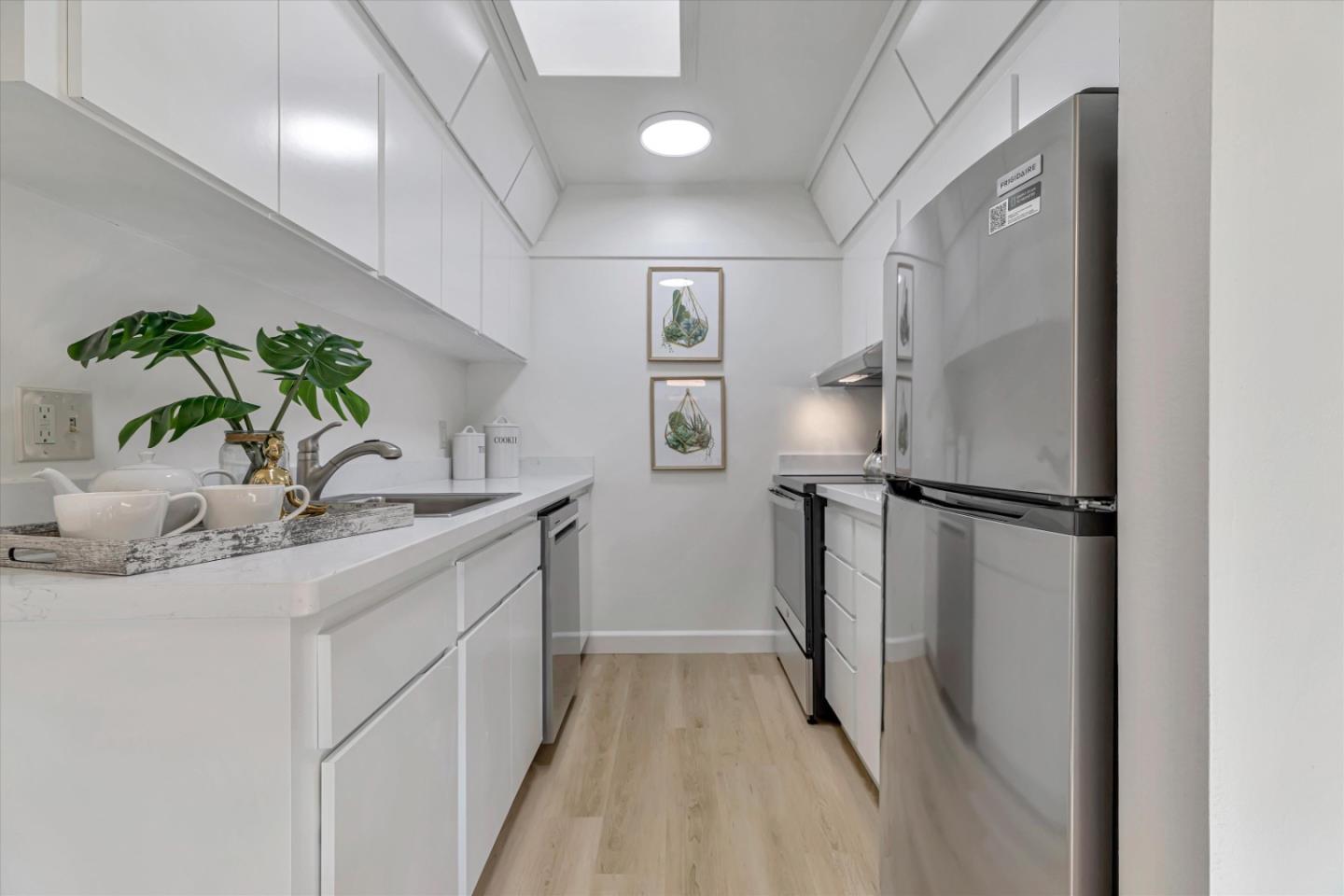 500 West Middlefield Road, Unit 142 Mountain View, CA 94043 - Photo 16 of 59 a kitchen with a sink and refrigerator