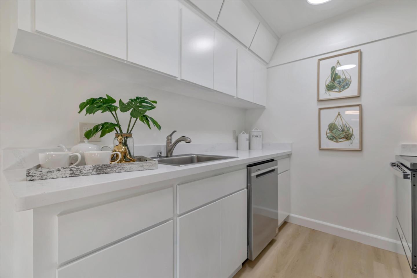500 West Middlefield Road, Unit 142 Mountain View, CA 94043 - Photo 17 of 59 a kitchen with sink and flower pot