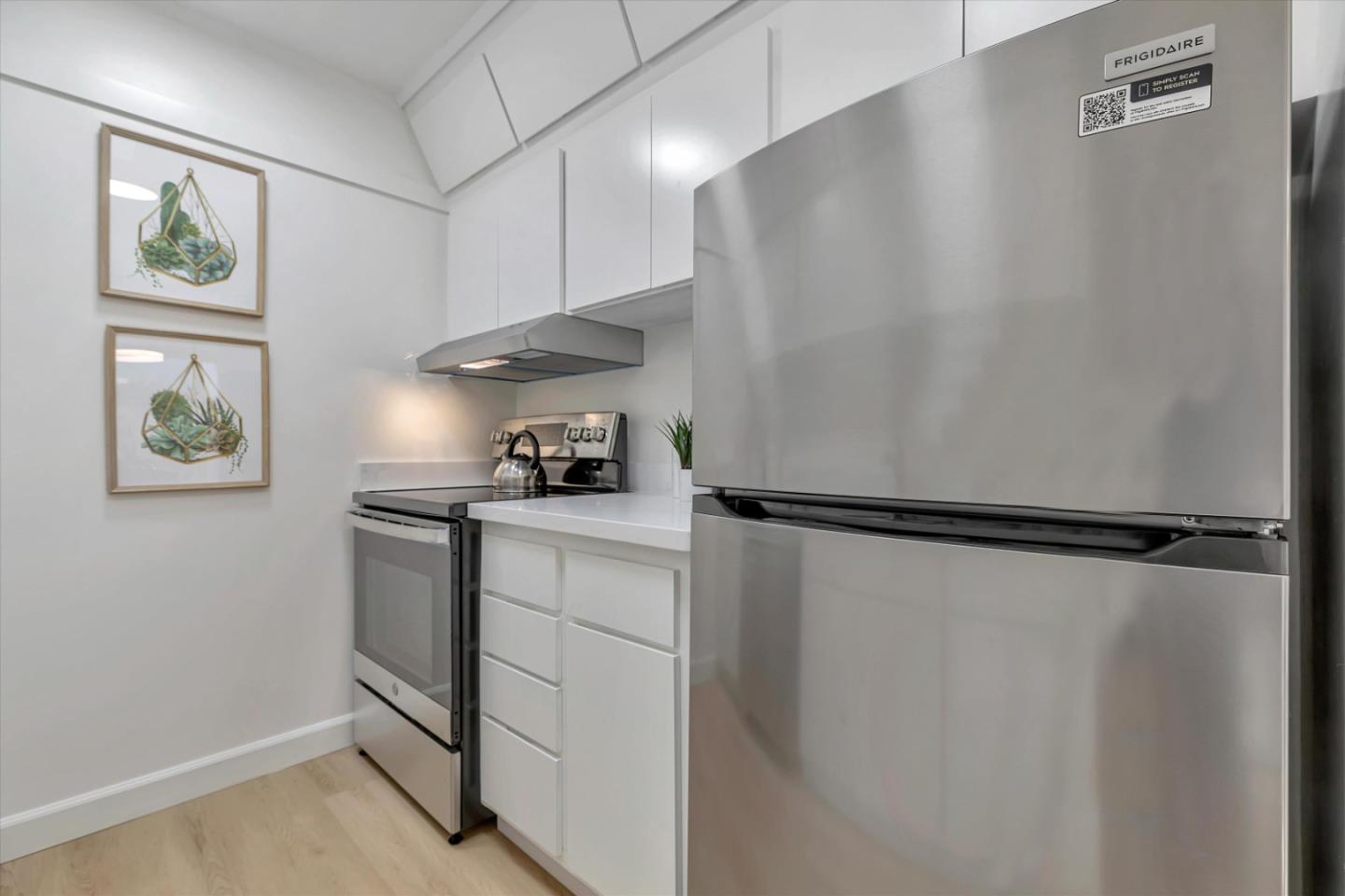 500 West Middlefield Road, Unit 142 Mountain View, CA 94043 - Photo 18 of 59 a kitchen with a refrigerator and a sink