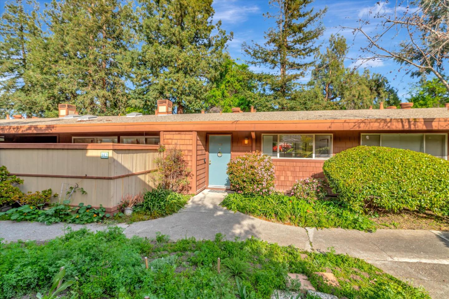 500 West Middlefield Road, Unit 142 Mountain View, CA 94043 - Photo 2 of 59 a view of a house with a garden