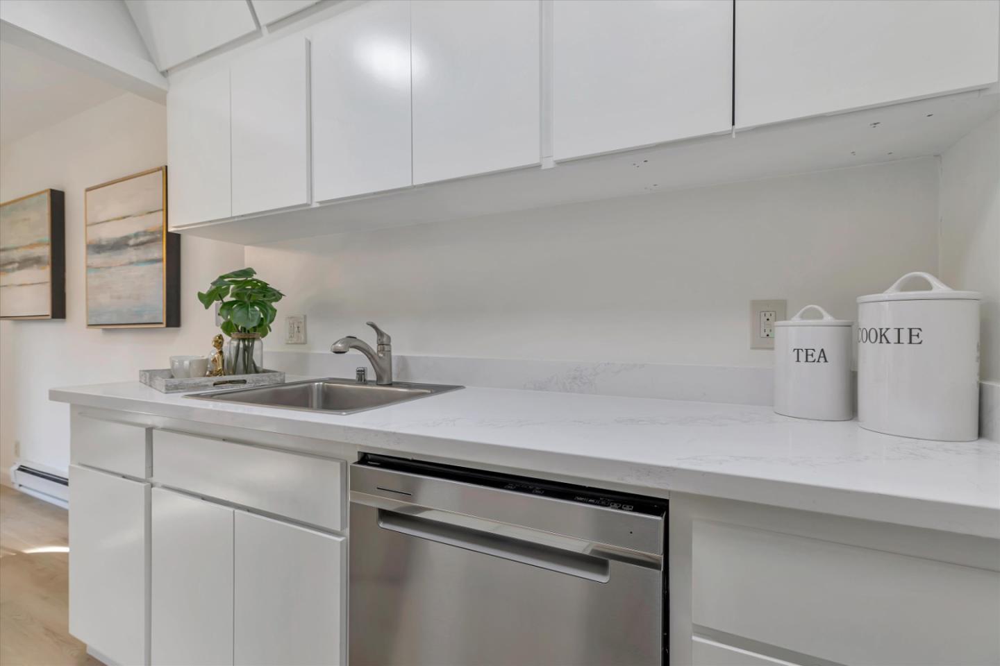 500 West Middlefield Road, Unit 142 Mountain View, CA 94043 - Photo 21 of 59 a kitchen with a sink and cabinets