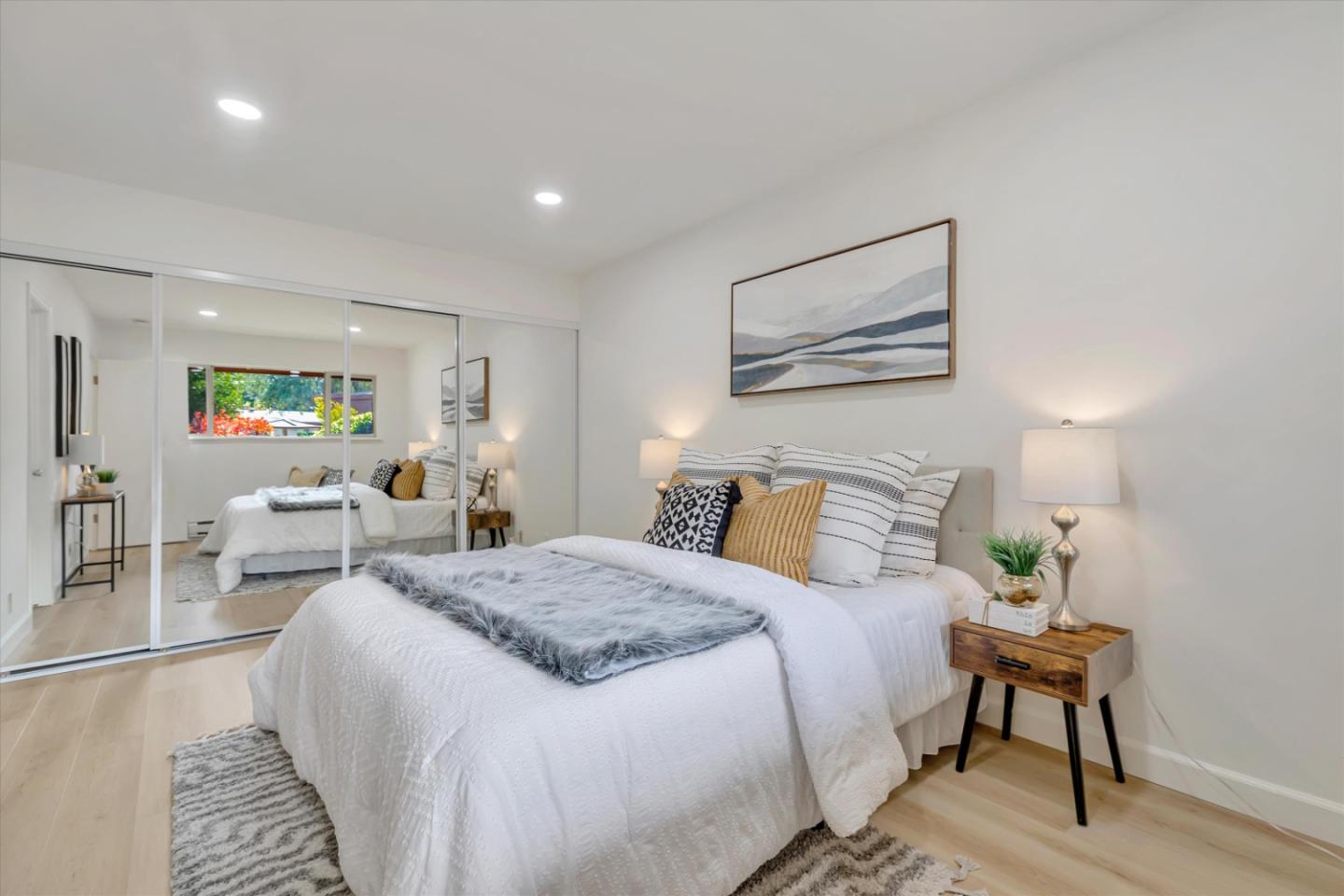 500 West Middlefield Road, Unit 142 Mountain View, CA 94043 - Photo 25 of 59 a bed room with a bed and a painting