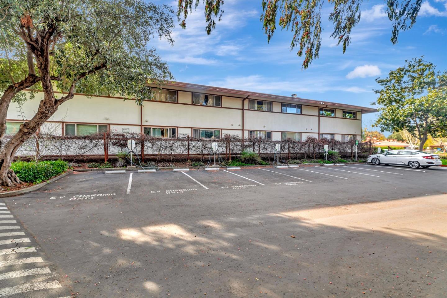 500 West Middlefield Road, Unit 142 Mountain View, CA 94043 - Photo 42 of 59 a city view with tall buildings and cars parked on road