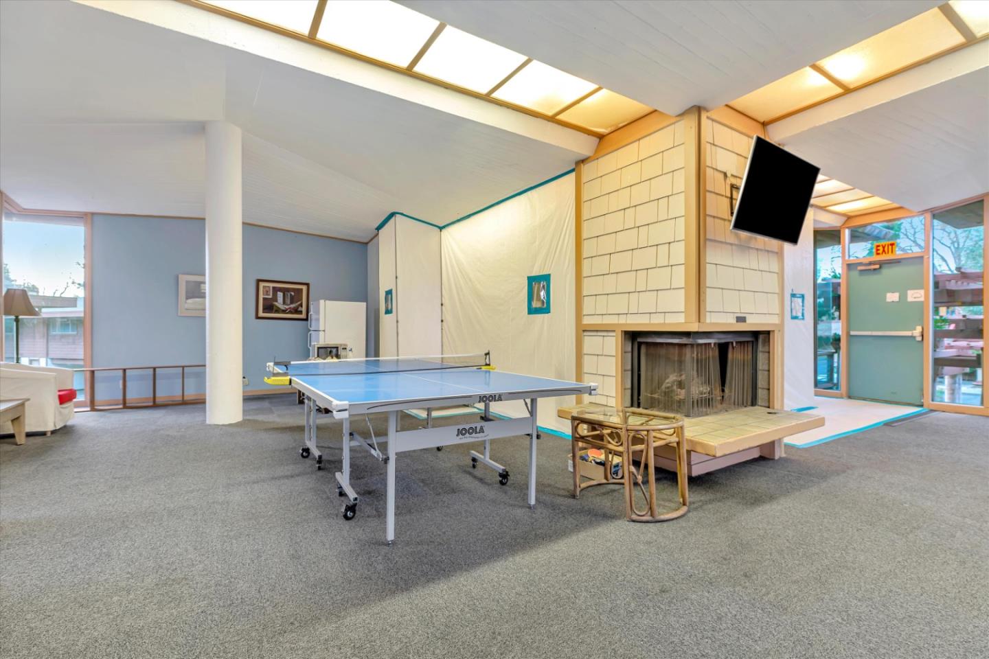 500 West Middlefield Road, Unit 142 Mountain View, CA 94043 - Photo 45 of 59 a living room with furniture pool table and a fireplace