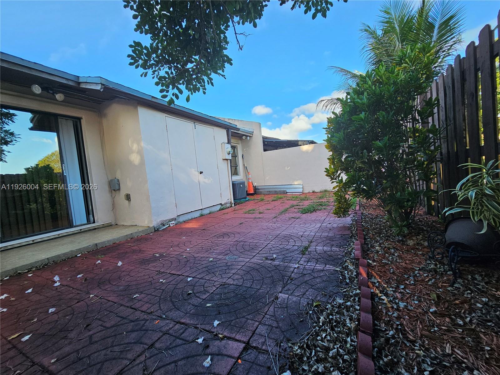 5317 Southwest 140th Place, Unit 5317 Miami, FL 33175 - Photo 18 of 30 a view of a backyard of the house