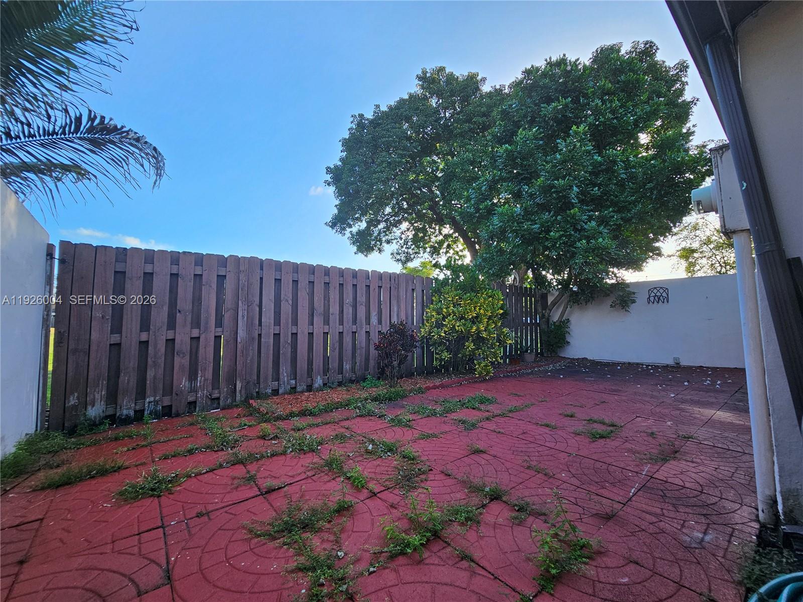 5317 Southwest 140th Place, Unit 5317 Miami, FL 33175 - Photo 19 of 30 a view of backyard with wooden fence