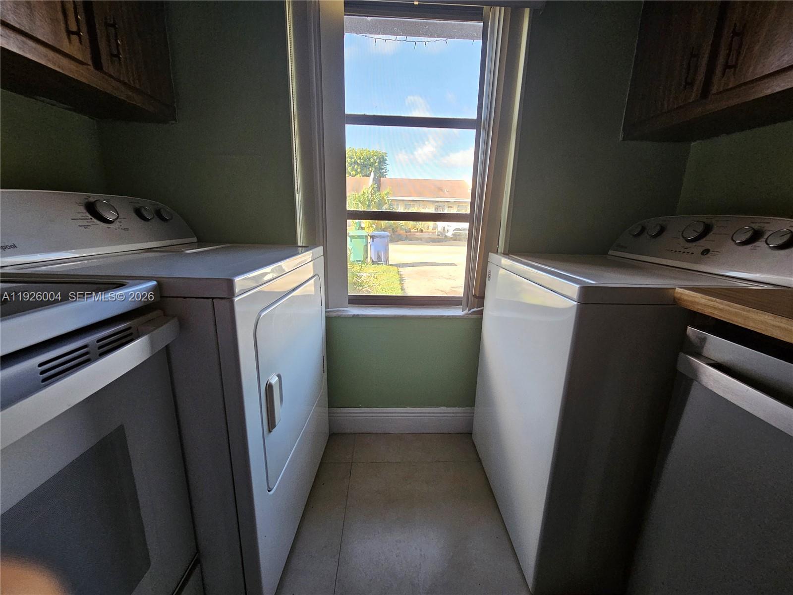 5317 Southwest 140th Place, Unit 5317 Miami, FL 33175 - Photo 7 of 30 a utility room with dryer and washer