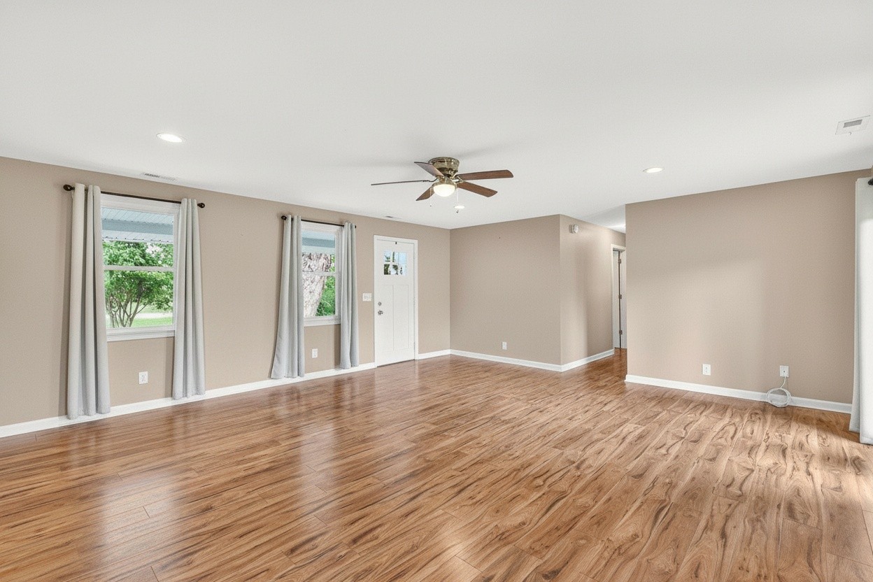 11914 Hogwood Road Milton, TN 37118 - Photo 14 of 44 a view of an empty room with wooden floor and a window
